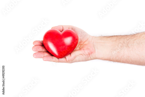 Heart in hand as love and health symbol