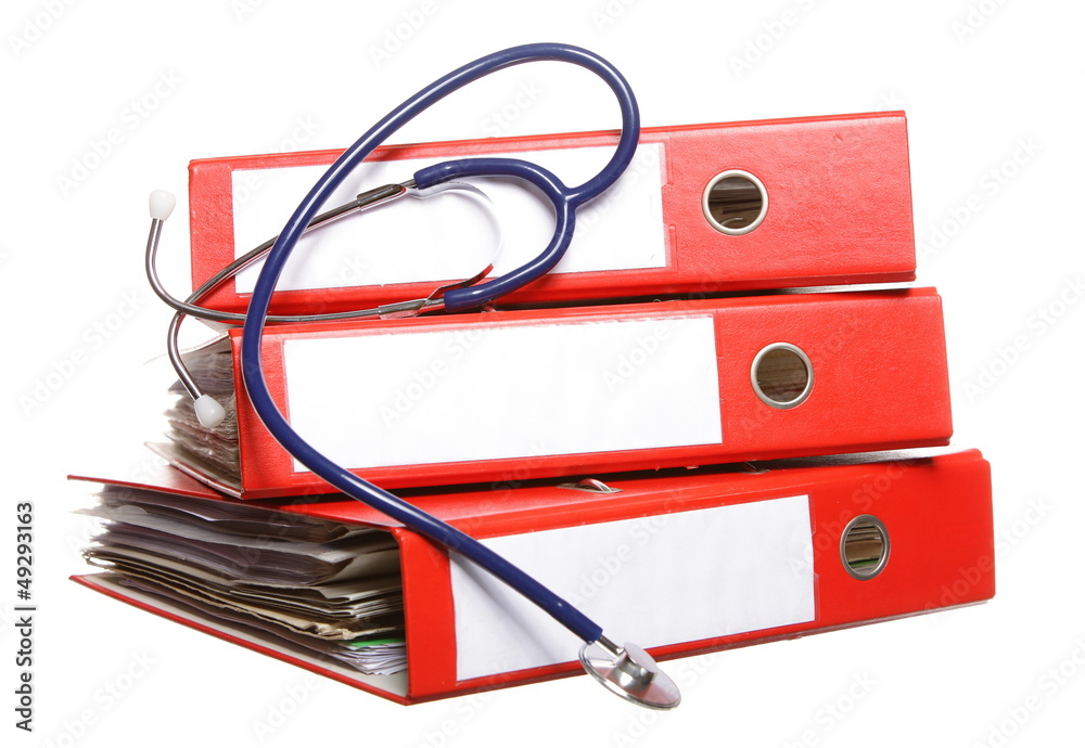File folders with stethoscope isolated on white File folders with stethoscope isolated on white