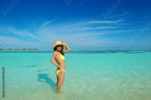 asian woman resting on sand at beach © .shock