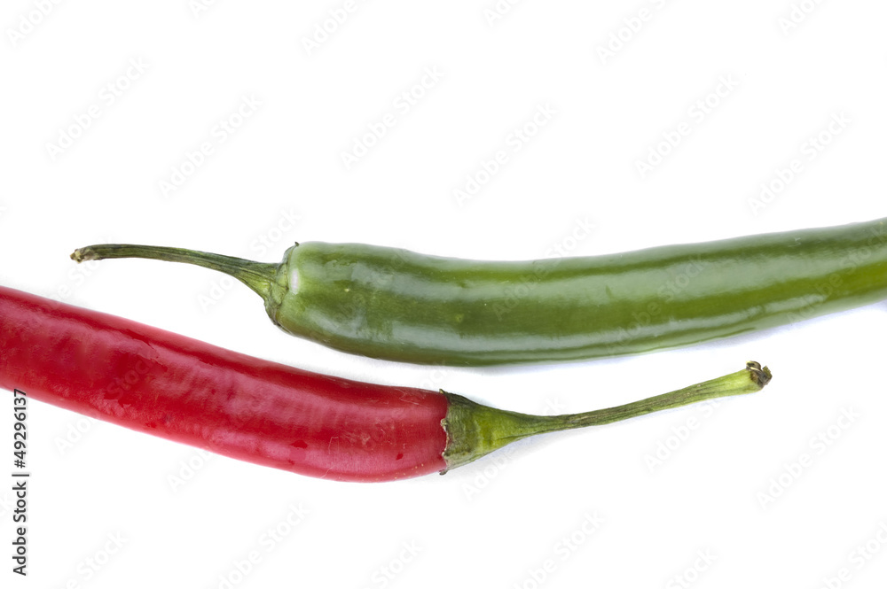 isolated  Red and green chili peppers vertical