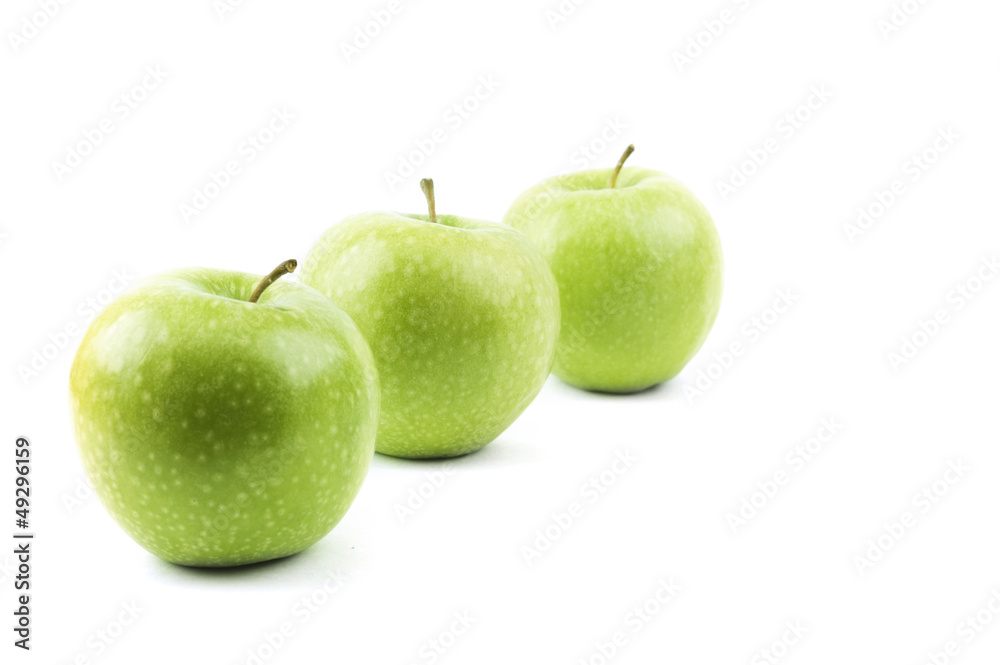 isolated perspective of three green apples isolated perspective of three green apples