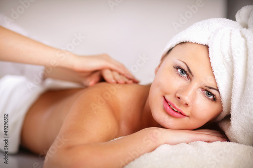 Closeup of an attractive young woman receiving massage