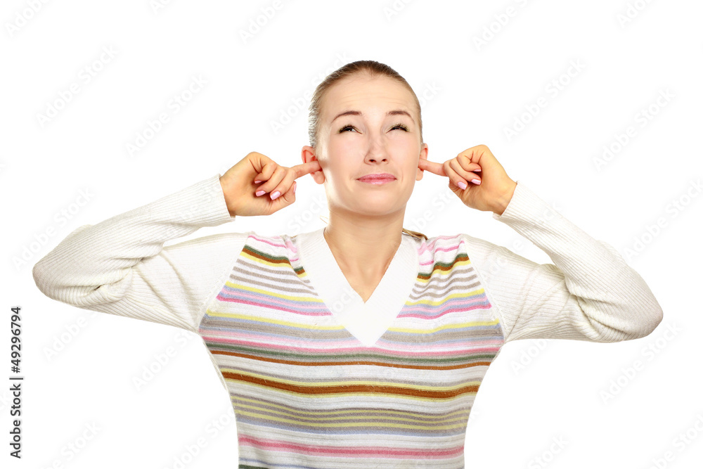 Closeup portrait of young woman covering ears Closeup portrait of young woman covering ears