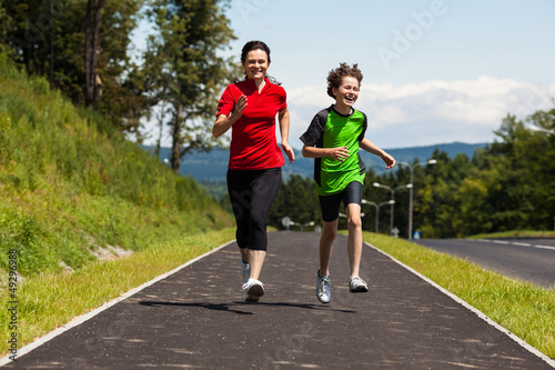 Mother with son running, jumping