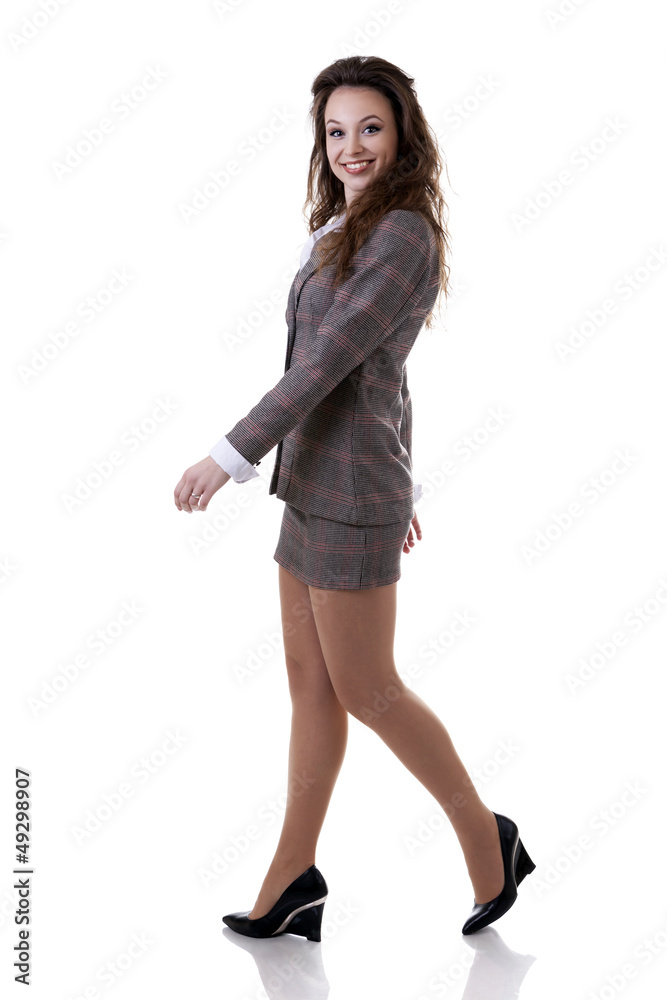 Walking smiling businesswoman isolated on white Walking smiling businesswoman isolated on white