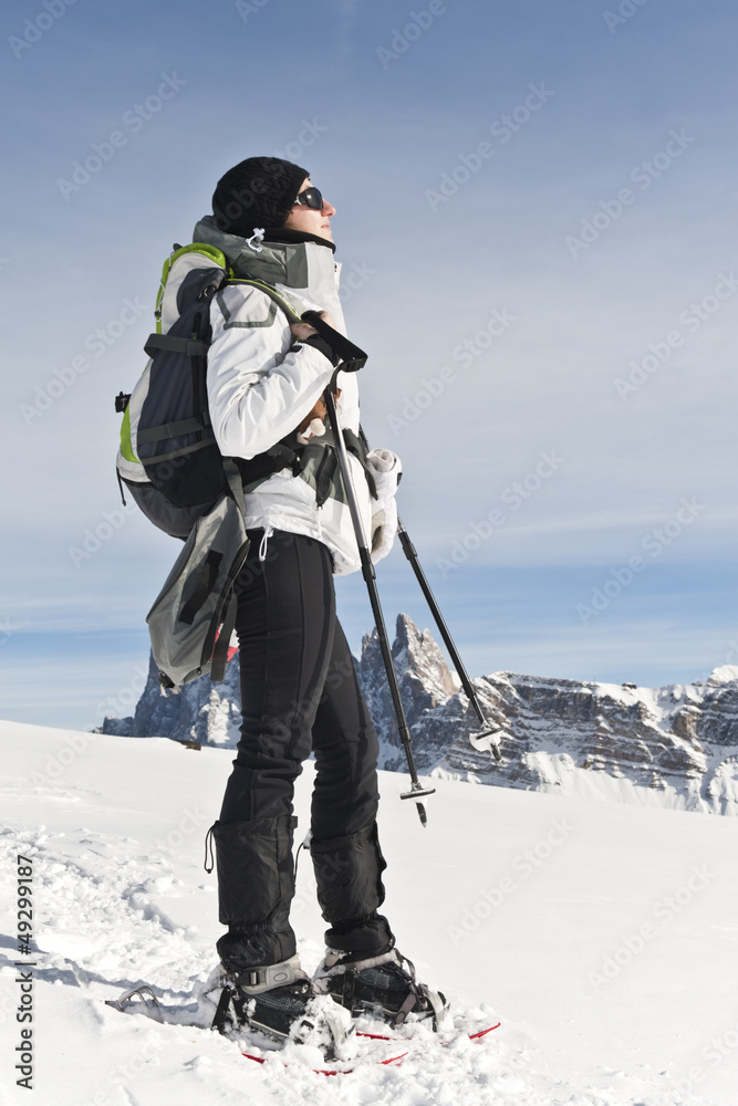 Girl stares at the Sun during Winter Holidays in Dolomites