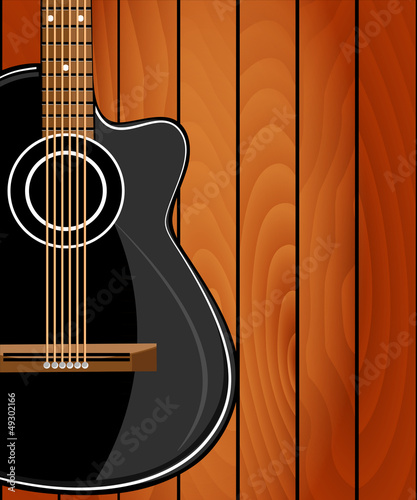Acoustic guitar on wood background