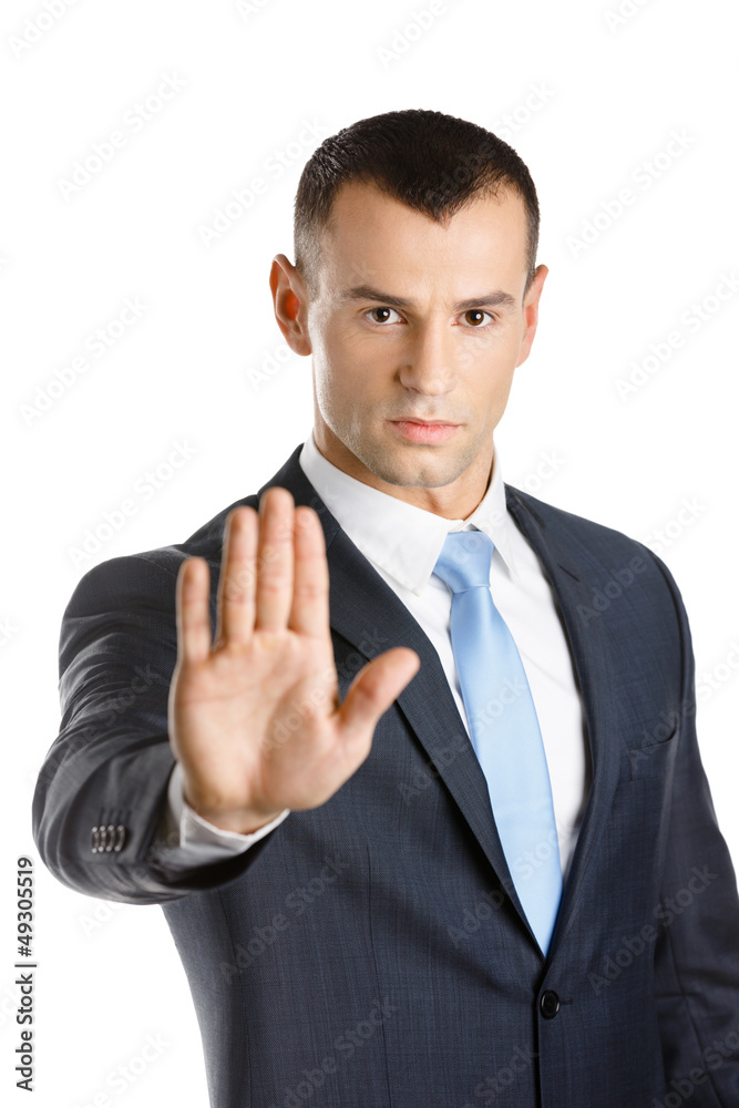 Businessman shows stop gesture, isolated on white Businessman shows stop gesture, isolated on white