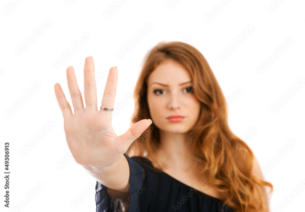 Young woman shows banning hand gesture isolated on white backgro Young woman shows banning hand gesture isolated on white backgro