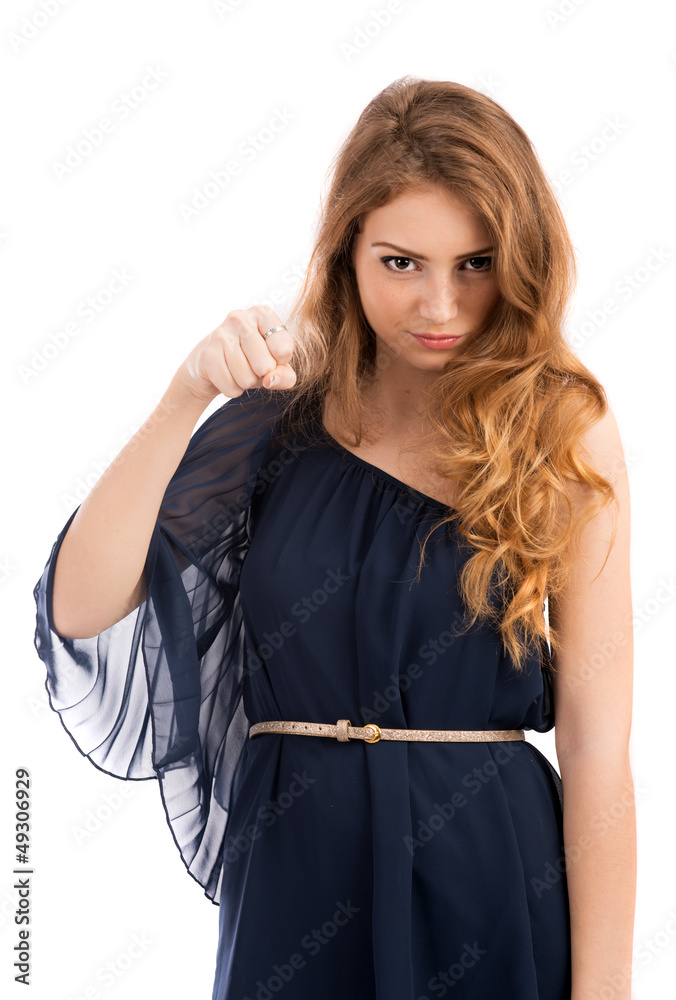 beautiful young woman showing his fist threateningly