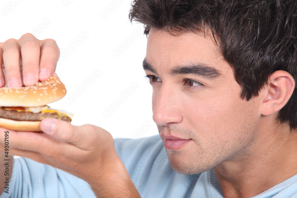 portrait of a young man with hamburger portrait of a young man with hamburger