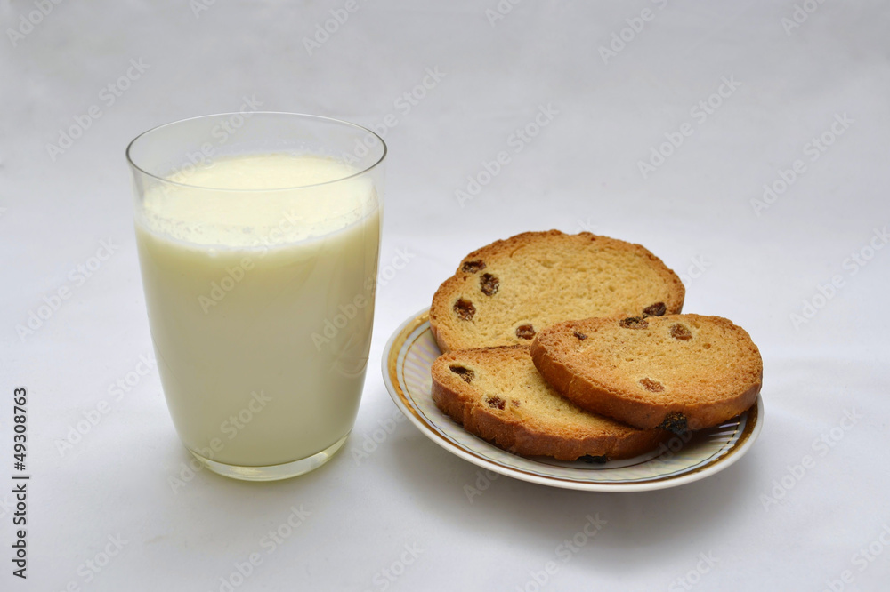 biscuits with raisins and milk on a white background biscuits with raisins and milk on a white background