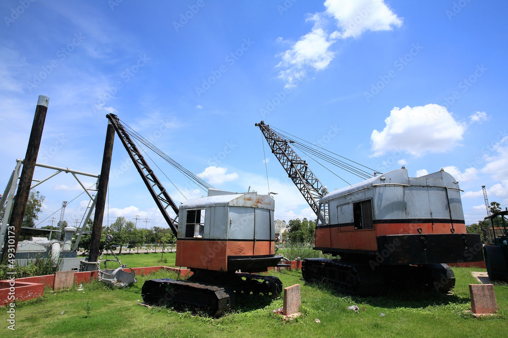 Fototapeta premium Old drag line excavators against blue sky