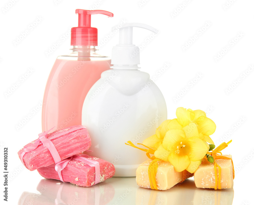 Liquid and hand-made soaps isolated on white Liquid and hand-made soaps isolated on white