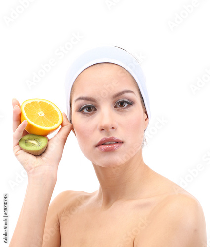 Young woman with fruit.Concept: Facial fruit masks. Isolated