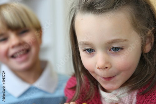 Portrait of a little girl near a little boy