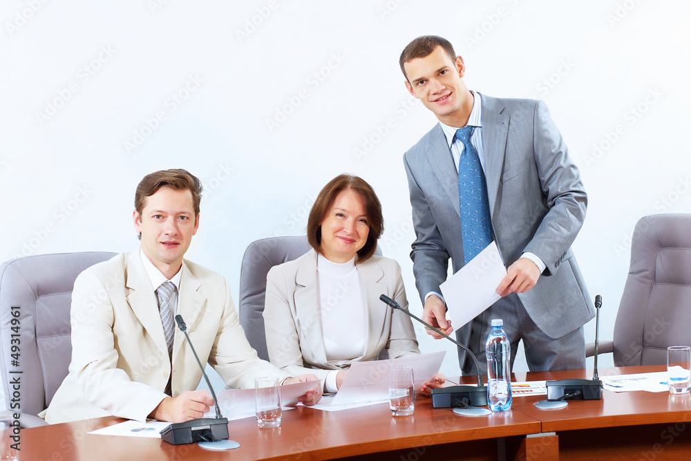 Three businesspeople at meeting Three businesspeople at meeting