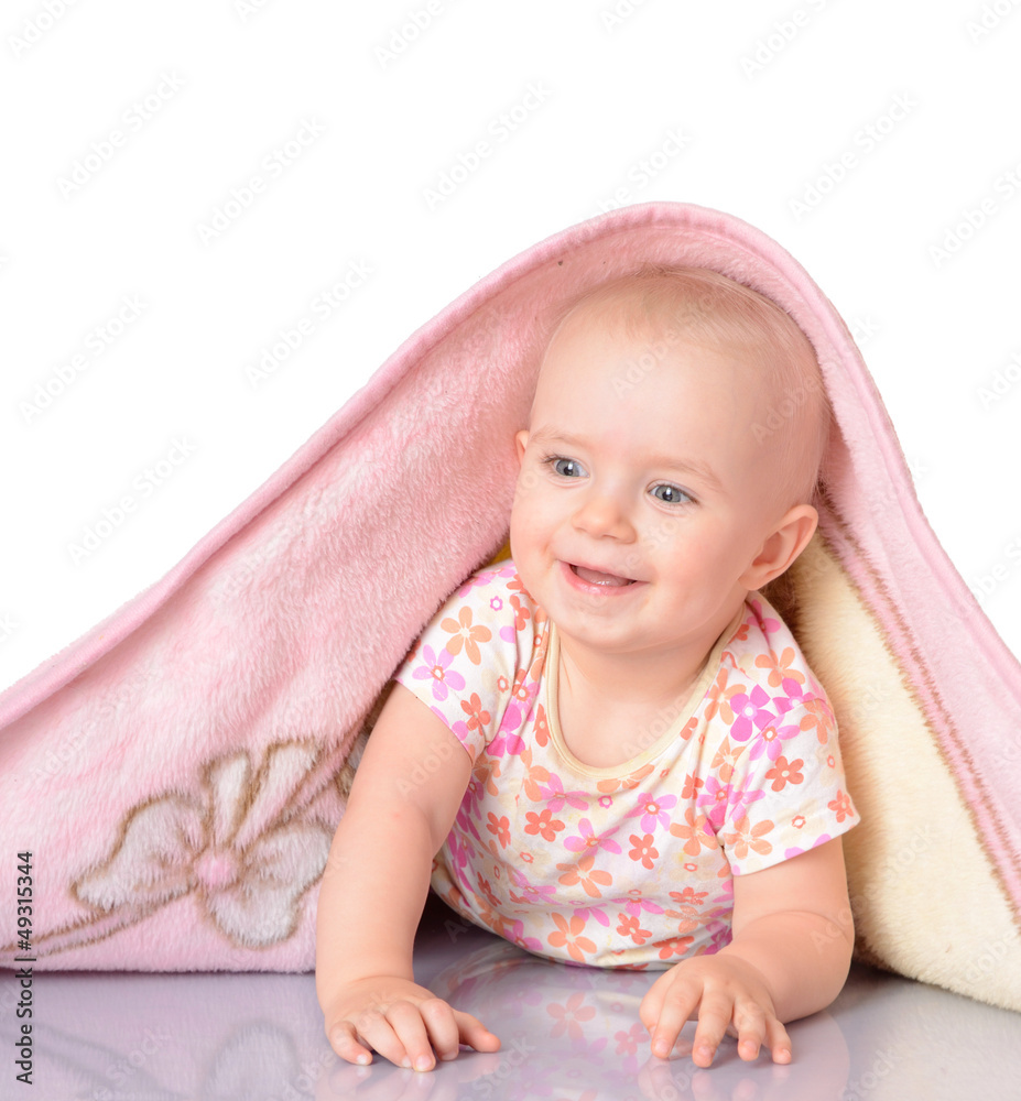 baby girl is hiding under the blanket over white backgroun baby girl is hiding under the blanket over white backgroun