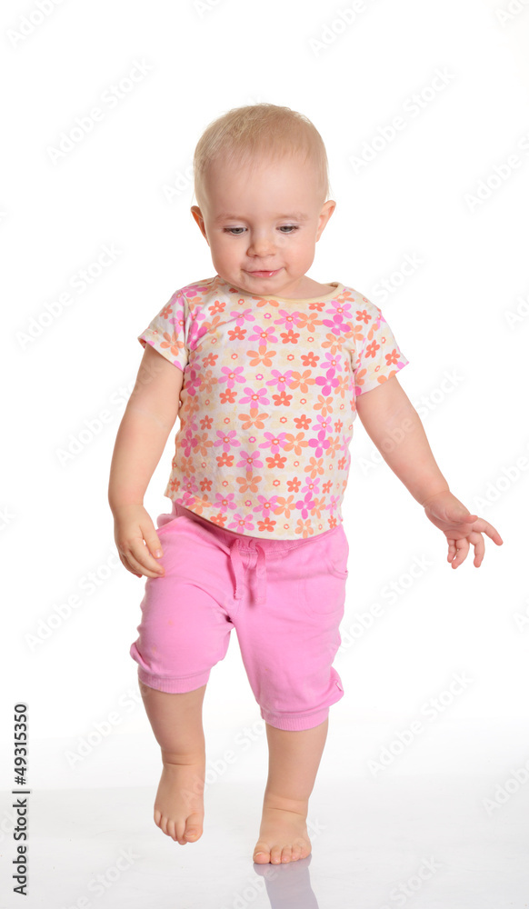 Funny baby girl running on white background Funny baby girl running on white background