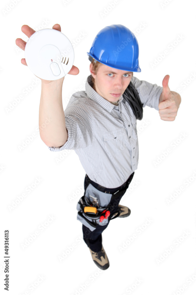 Tradesman approving of the use of smoke detectors