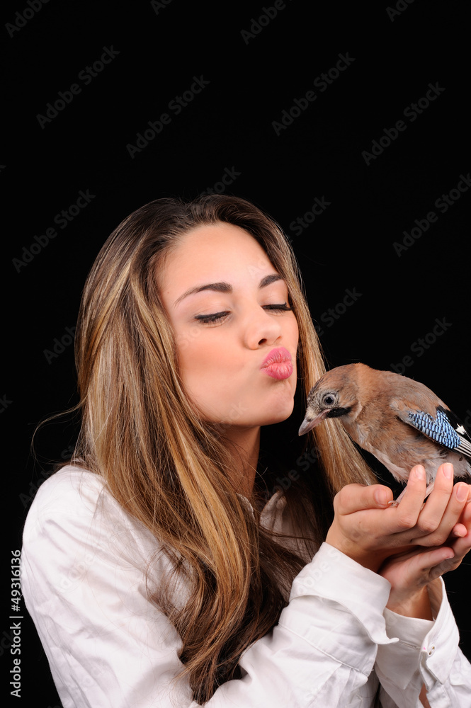 Portrait of beautiful girl with bird on the hand Portrait of beautiful girl with bird on the hand