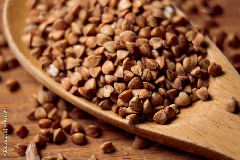 buckwheat groats and wooden spoon