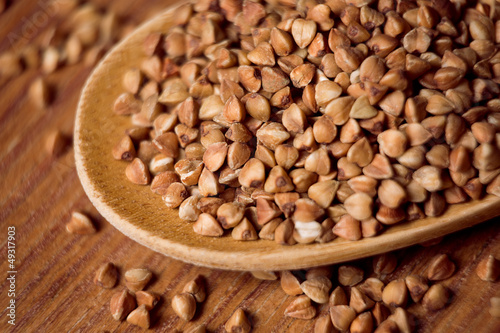 buckwheat groats and wooden spoon