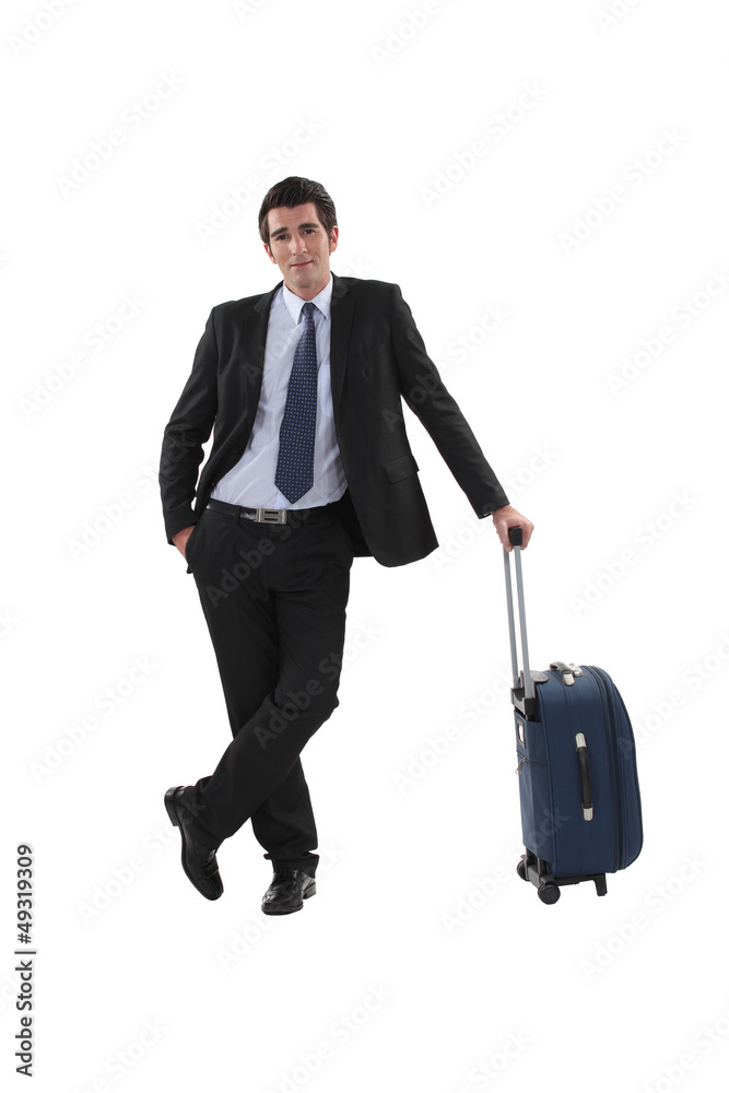 Businessman with luggage stood waiting Businessman with luggage stood waiting