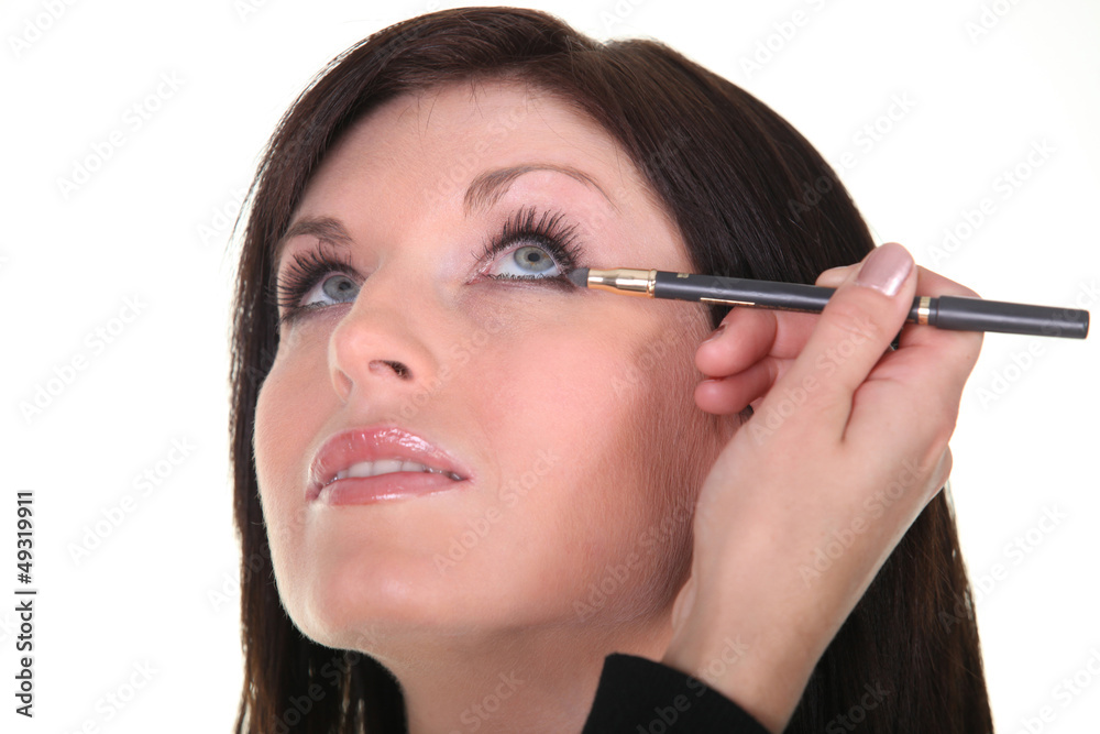 blue-eyed brunette being made up blue-eyed brunette being made up