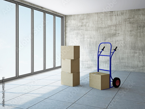 Empty room with boxes and p...