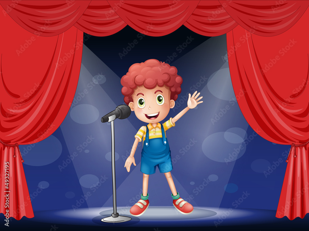 Naklejka premium A boy performing on the stage