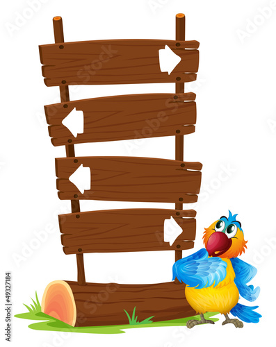 A colorful parrot beside a signboard