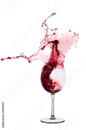 red wine splashing out of a glass, isolated on white