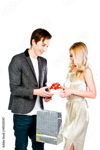 man gives a young and beautiful woman a gift