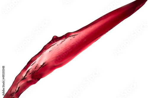 red wine splashing out of a glass, isolated on white