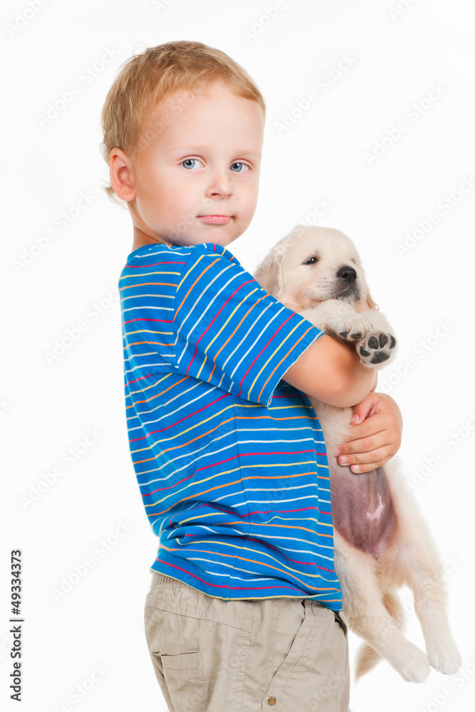 Little boy with puppy, on a gray background Little boy with puppy, on a gray background