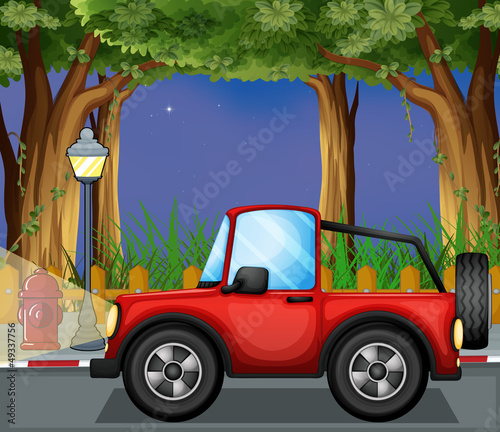 A red jeepney in the road