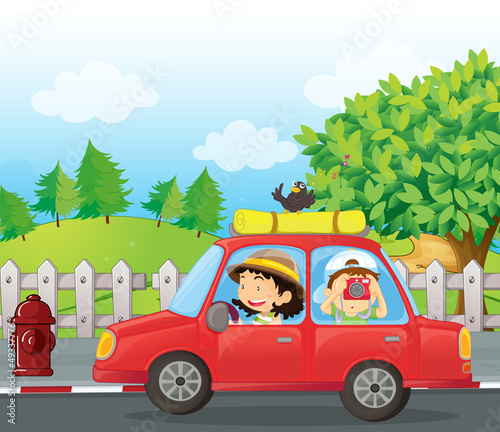 A boy and a girl in a car