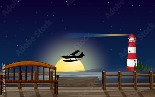 A light house, an airplane and a sea