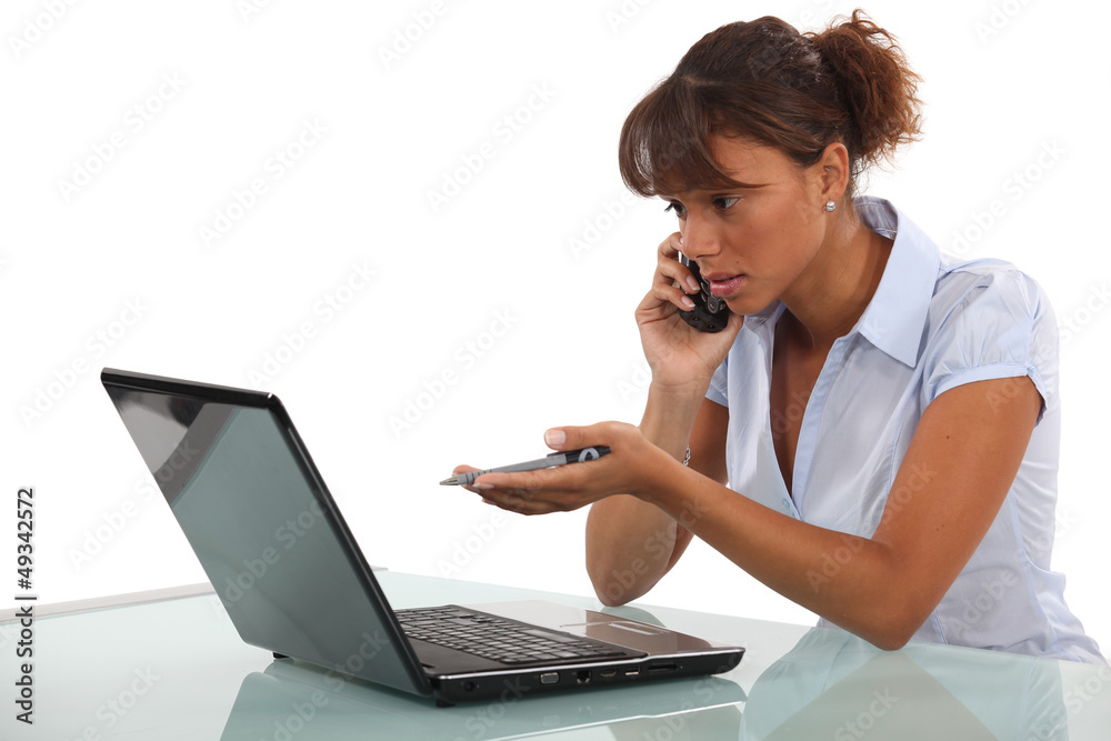 Businesswoman calling technical help desk Businesswoman calling technical help desk