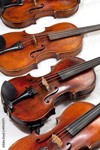 several used fiddles