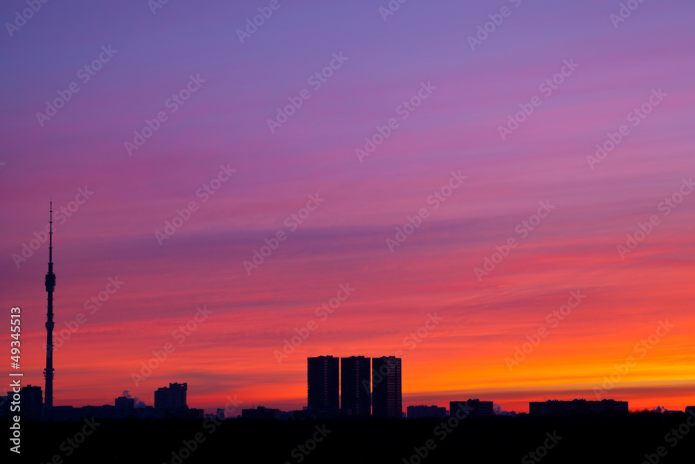 sunrise colors under city
