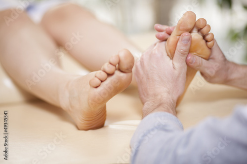 Giving a foot rub at a healthy and beauty spa