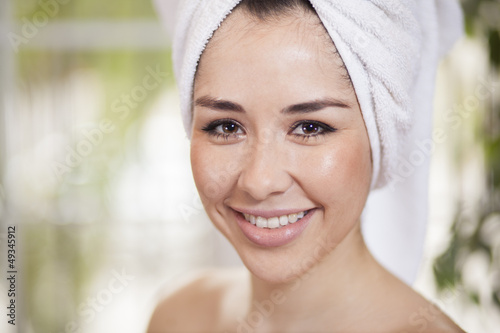 Cute young woman smiling after taking a bath