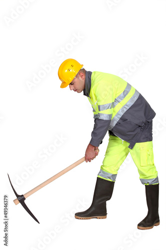 Road-worker with pick-axe