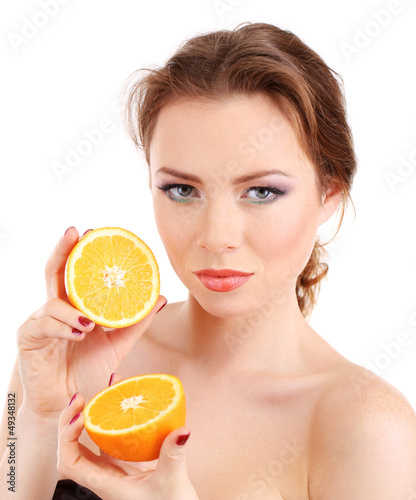 Beautiful young woman with bright make-up, holding orange,