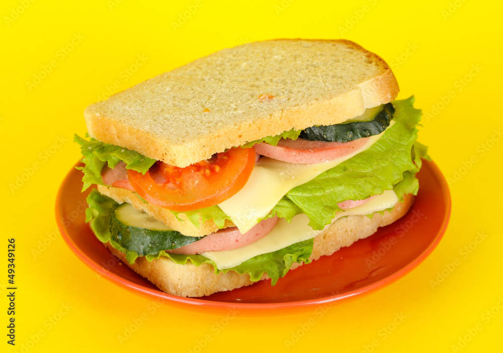 Sandwich on plate on yellow background Sandwich on plate on yellow background