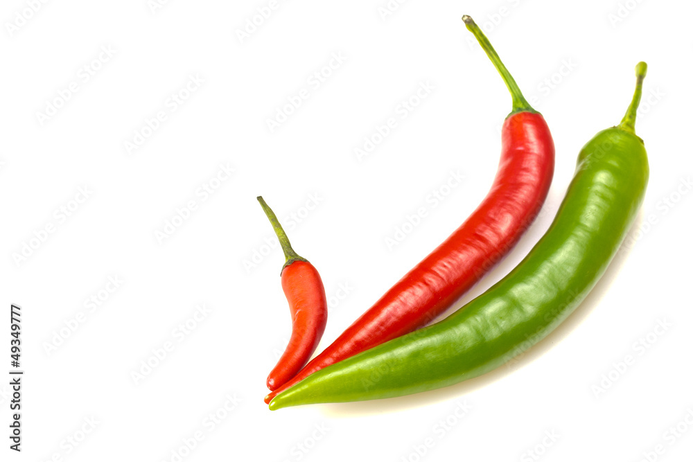 Group of green and red chilli peppers.