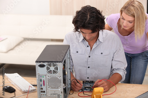 technician repairing a computer