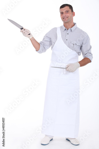 Butcher holding knife